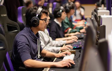 Row Of Students Playing On HUB Esports Arena PCs