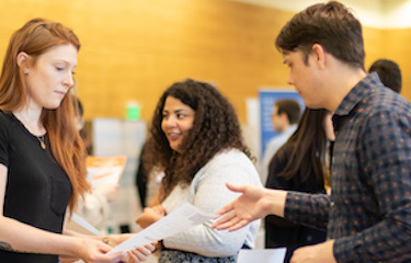 Student Handing Over A Document To Someone 