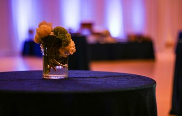 Flowers in a Vase Sitting on a Table